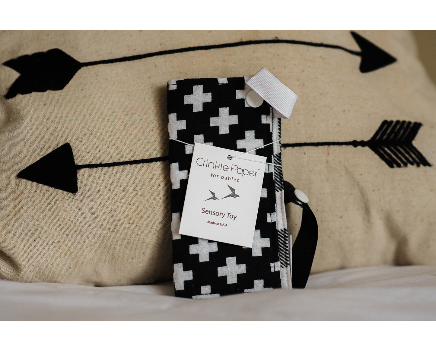 Crinkle Paper for Babies, sensory stimulation toy, Swiss Cross. The crinkle sound keeps babies entertained, while the size allows the baby to increase dexterity.