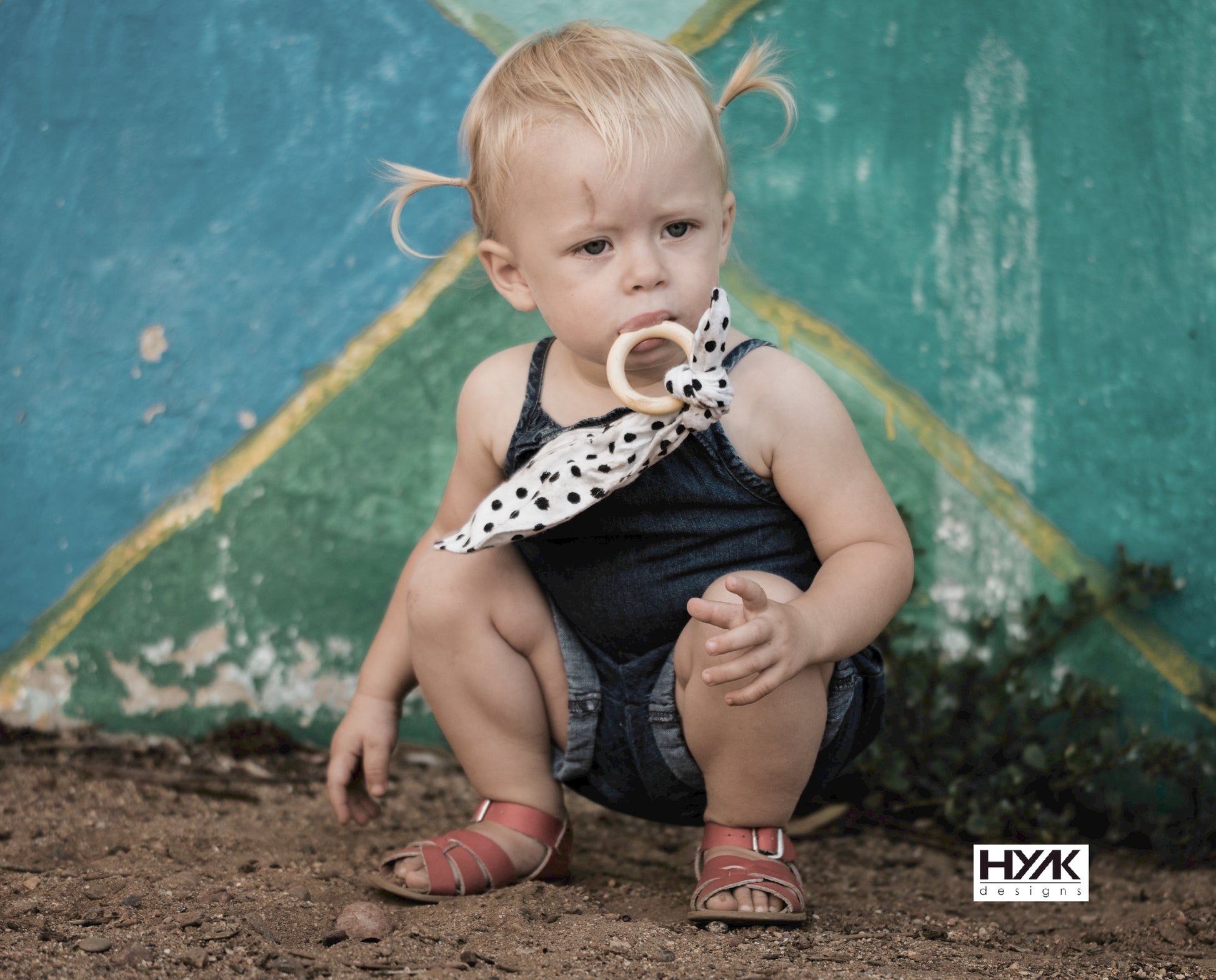 Eco-friendly wooden ring for baby teething and sensory play.